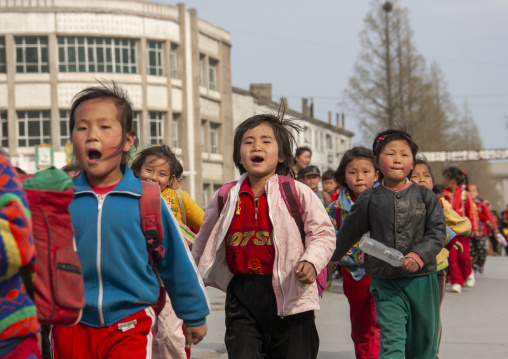 Children parading in the streets on the international workers' day, Kangwon Province, Wonsan, North Korea