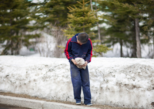 North korean boy bowing to someone, Ryanggang, Samjiyon, North Korea