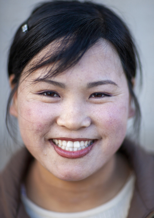 Portrait of a smiling North Korean woman, North Hamgyong, Jung Pyong Ri, North Korea