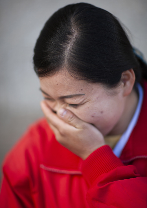 Portrait of a laughing North Korean woman, North Hamgyong, Jung Pyong Ri, North Korea