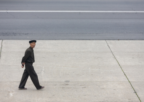 North Korean man walking in the street, DGC, Pyongyang, North Korea