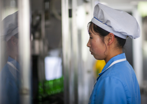 North Korean worker woman in kangso yaksu mineral water factory, South Pyongan, Nampo, North Korea