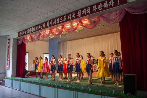 North Korean girl singing during a show for toursist in a school, DGC, Pyongyang, North Korea