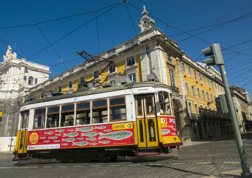 Famous vintage yellow tram 25 in the street, Lisbon district, Lisbon, Portugal