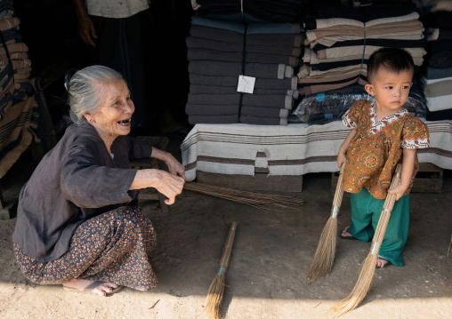 Grand mother and boy in a fabric shop, Yangon region, Yangon, Myanmar