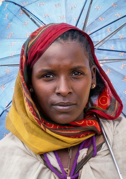 Ethiopian woman under an umbrella, Amhara Region, Lalibela, Ethiopia
