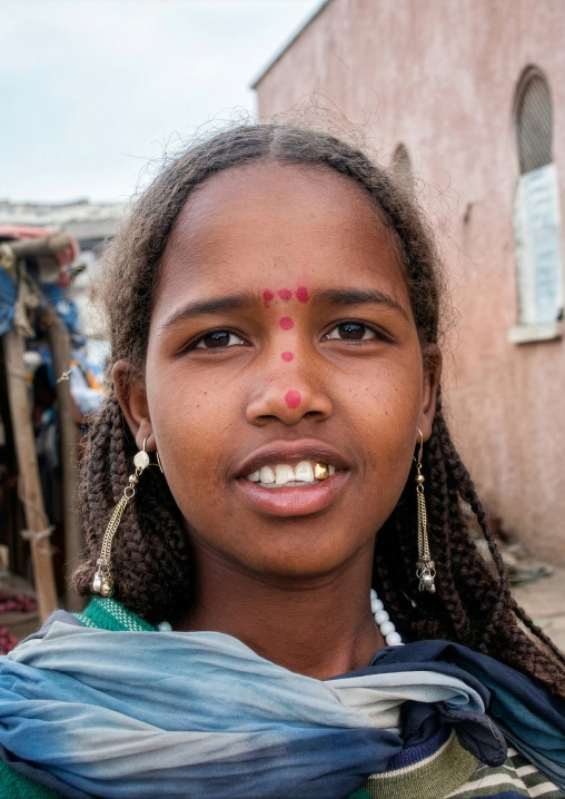 Beautiful teenage girl in pink in the street, Harari region, Harar, Ethiopia