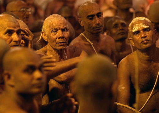 Men becoming Naga Sadhu in Maha Kumbh Mela, Uttar Pradesh, Allahabad, India