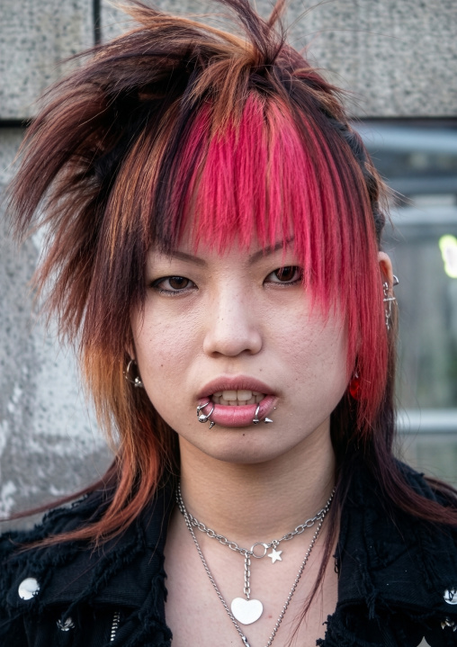 Cosplay girl with pink hair in Harajuku, Kanto region, Tokyo, Japan
