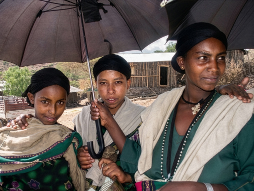 Ethiopian women under umbrellas, Amhara Region, Lalibela, Ethiopia