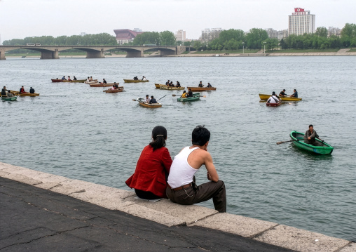 North Korean people paddling on small boats on Taedong river, DGC, Pyongyang, North Korea