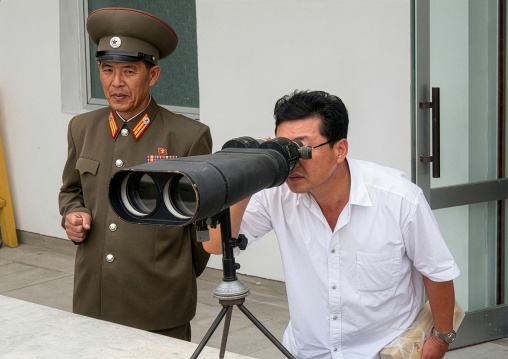 North Korean guide looking at south Korea from the DMZ, North Hwanghae Province, Panmunjom, North Korea