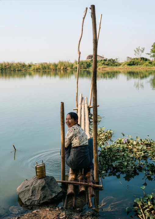 Woman washing clothes, Shan State, Inle Lake, Myanmar