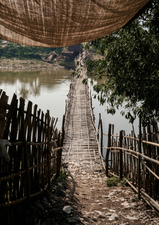 Suspended wooden bridge over a river, Shan State, Inle Lake, Myanmar