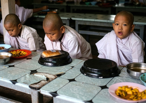 Young novices praying before eating, Mrauk U, Myanmar