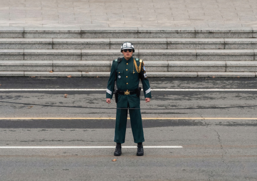 outh Korean soldier standing on the demarcation line in the DMZ, North Hwanghae, Panmunjom, North Korea