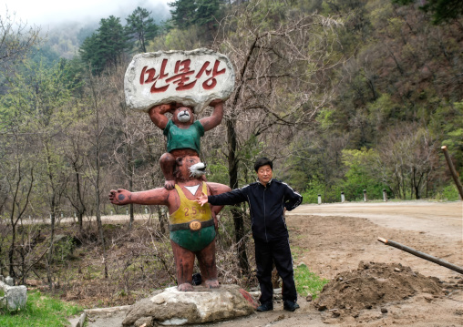 North Korean guide in Chilbo hills with bears statues, North Hamgyong province, Chilbosan, North Korea