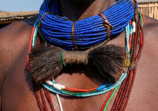 Mucubal tribe woman with cow tail necklace, Namibe Province, Virei, Angola