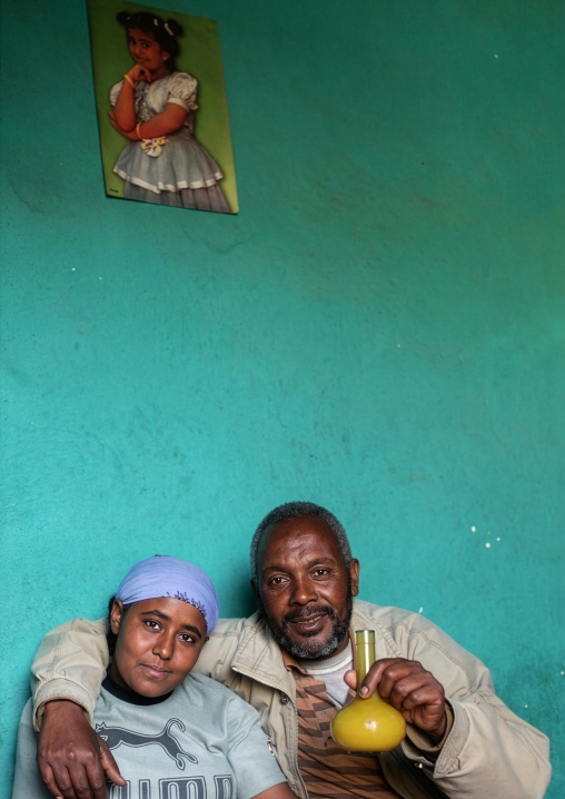 Ethiopian couple drinking tej in a bar, Amhara Region, Lalibela, Ethiopia