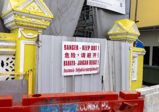 Danger sign in front of a renovatedn heritage shophouse, Central Region, Singapore, Singapore