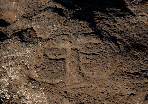 Human face petroglyph in ahu tongariki area, Easter Island, Hanga Roa, Chile