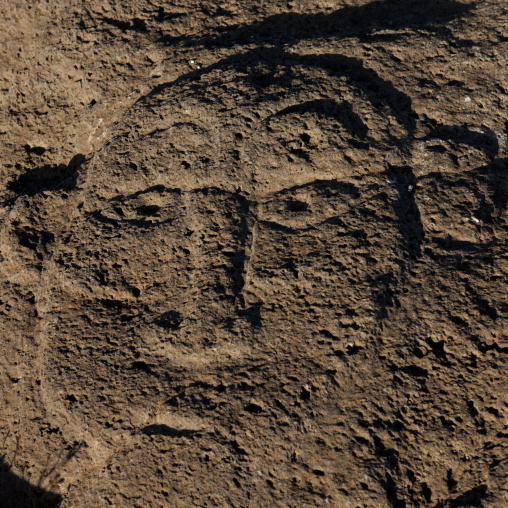 Human face petroglyph in ahu tongariki area, Easter Island, Hanga Roa, Chile