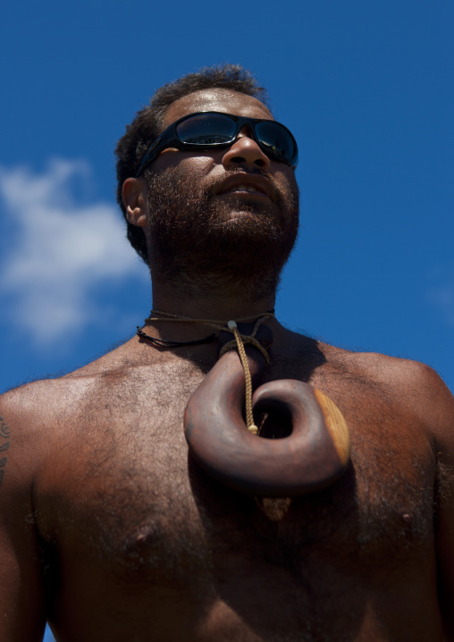 Native man from easter island with big pendant, Easter Island, Hanga Roa, Chile