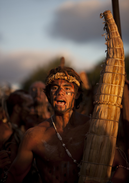 Man with totora boat during tapati festival, Easter Island, Hanga Roa, Chile