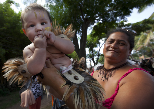 Mother and baby during tapati festival, Easter Island, Hanga Roa, Chile
