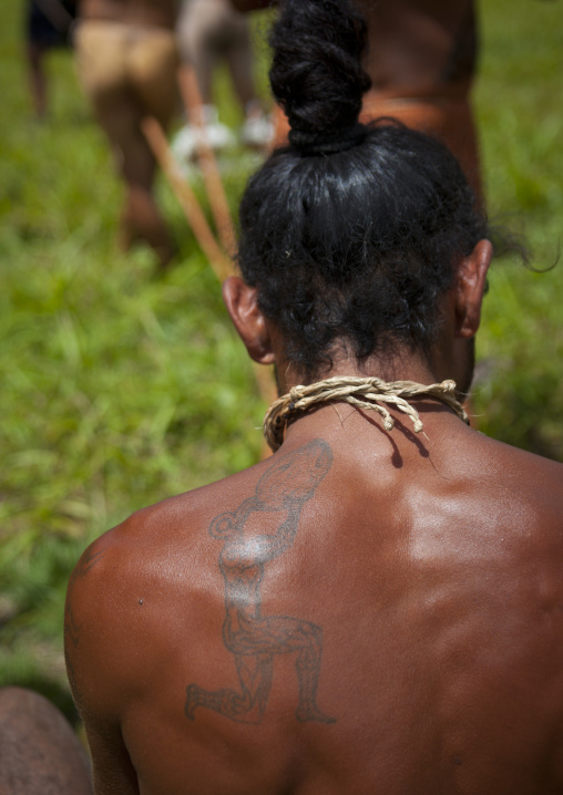 Tattoo on the shoulder of a native man, Easter Island, Hanga Roa, Chile