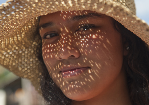 Young woman from easter island with hat, Easter Island, Hanga Roa, Chile