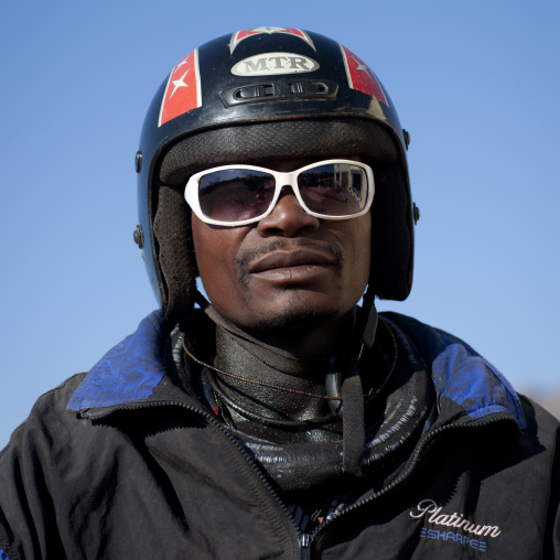 Himba With A Helmet And Sunglasses On A Motorbike, Village Of Oncocua, Angola