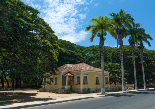 Old portuguese colonial house with palm trees, Namibe Province, Namibe, Angola
