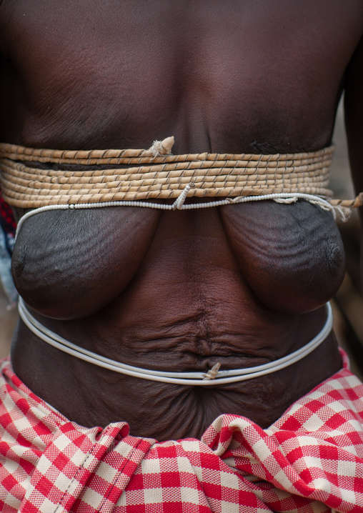 Mucubal tribe woman traditional bra made with ropes, Namibe Province, Virei, Angola