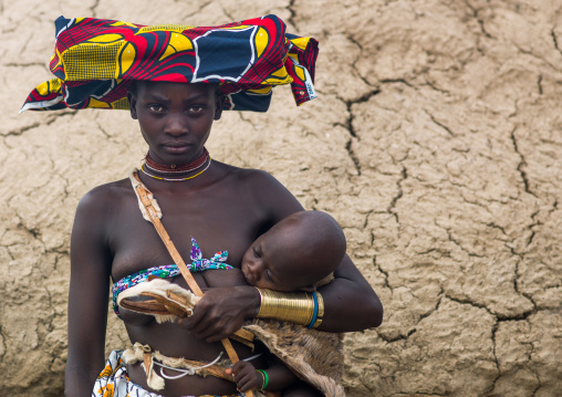 Mucubal tribe young woman with her baby, Namibe Province, Virei, Angola