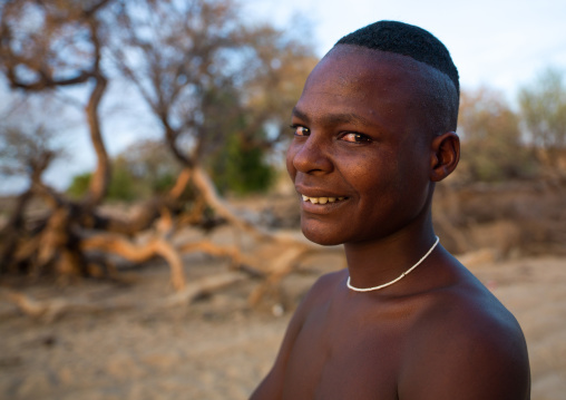 Portrait of a smiling mucubal tribe man, Namibe Province, Virei, Angola