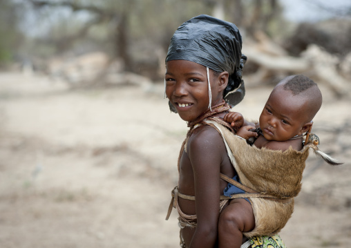 Mucubal Girl Carrying Her Young Brother On Her Back, Virie Area, Angola