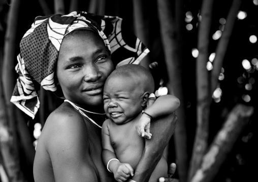 Mucubal Woman With Her Baby Crying In Her Arms, Virie Area, Angola