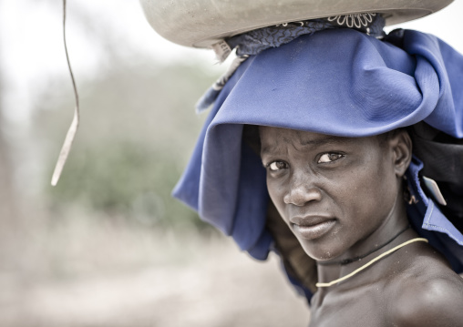 Mucubal Woman With Ompota Headdress Carrying A Basket On Her Head, Virie Area, Angola
