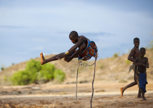 Mukubal Kids Doing High Jumping, Virie Area, Angola