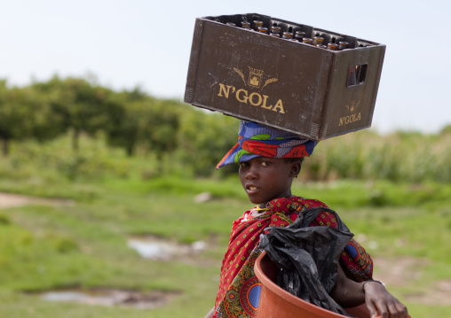 Mwila Girl Carrying A Crate Of Beer On Her Head, Chibia Area, Angola