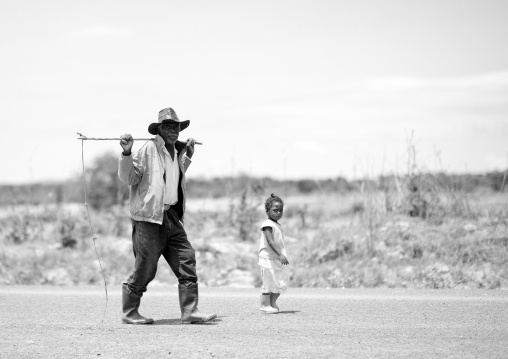 Man And Young Girl Walking On The Road, Lubango, Angola
