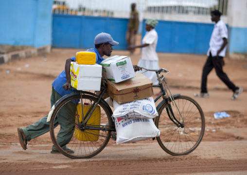 Man Carrying A Heavy Load On His Bicycle, Malanje, Angola