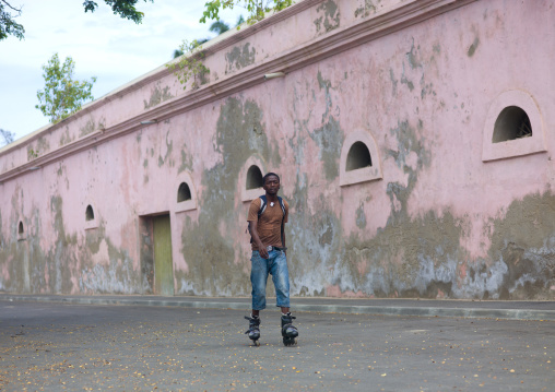 Young Man Doing Roller In Front Of The City Wall In Benguela, Angola