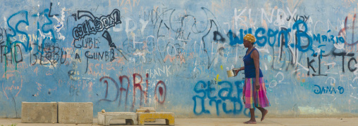 Woman Passing By A Wall Covered With Graffiti, Benguela, Angola