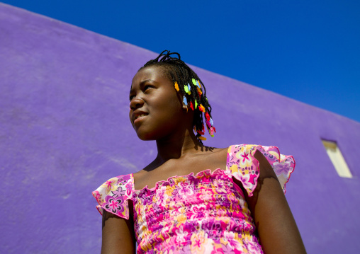 Girl In Front Of A Purple Wall In Namibe Town, Angola