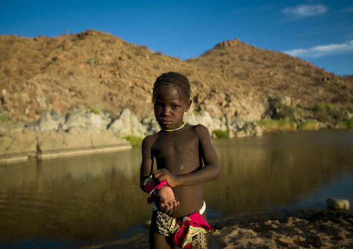 Young Boy Covedred With Sand At Pediva Hot Springs, Angola