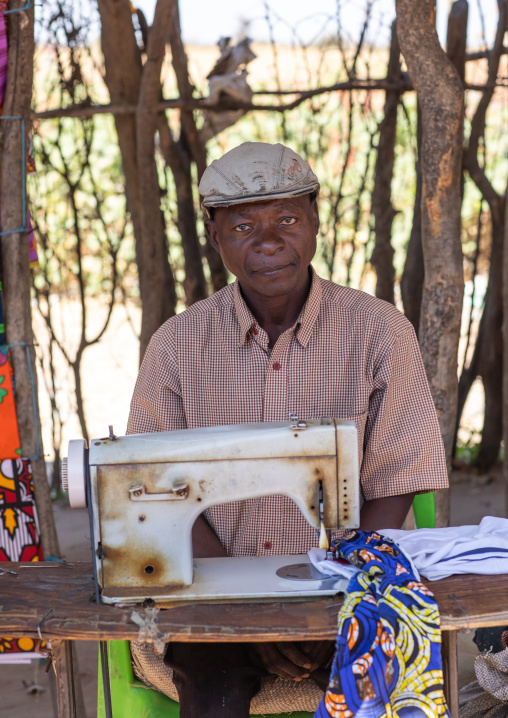 Angola man working with his sewing machine, Huila Province, Chibia, Angola