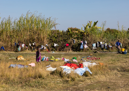 Women washing clothes in the bush, Huila Province, Chibia, Angola