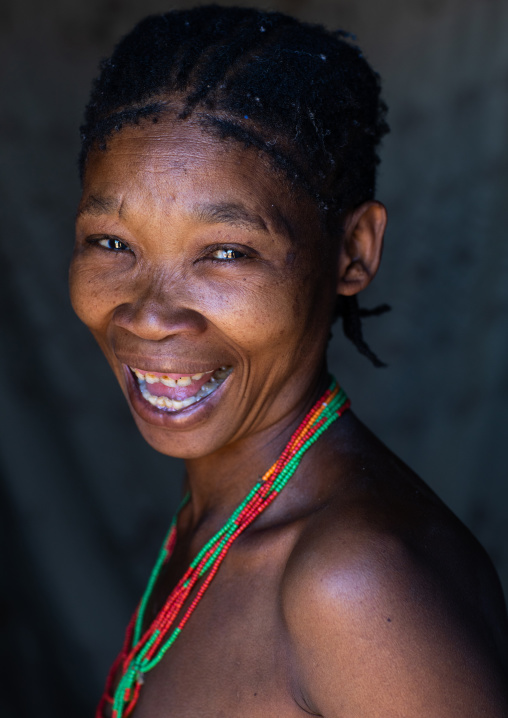 San tribe woman smiling portrait, Huila Province, Chibia, Angola